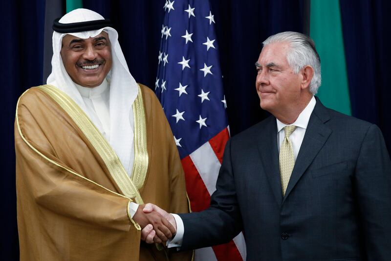 Kuwait's Foreign Minister Sheikh Sabah Al-Khale�������d Al-Hamad Al-Sabah, left, shakes hands with Secretary of State Rex Tillerson during the U.S.-Kuwait Strategic Dialogue at the State Department, Friday, Sept. 8, 2017, in Washington. (AP Photo/Jacquelyn Martin)