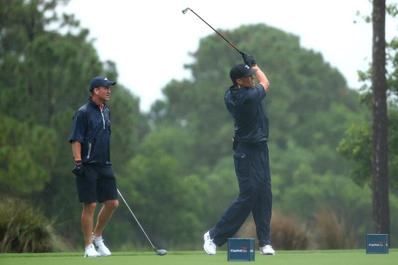 Tom Brady  plays his shot from the 14th tee . Getty