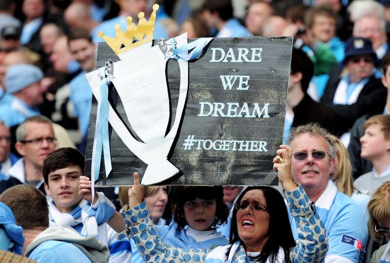 MANCHESTER, ENGLAND - MAY 13:  Manchester City fans cheer on their team during the Barclays Premier League match between Manchester City and Queens Park Rangers at the Etihad Stadium on May 13, 2012 in Manchester, England.  (Photo by Shaun Botterill/Getty Images)