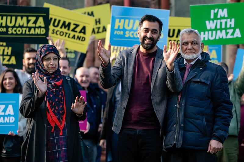 Mr Yousaf with his mother Shaaista and father Muzaffar in Glasgow as he campaigns to become the next leader of the Scottish National Party, in February 2023. Getty Images