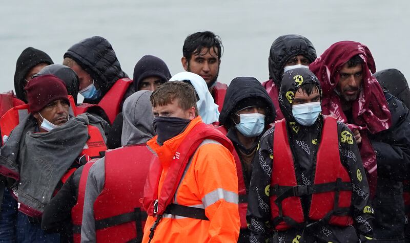 A group of people thought to be migrants are taken to Dover, Kent, onboard a Border Force vessel, following a small boat incident in the Channel. Picture date: Monday May 23, 2022.