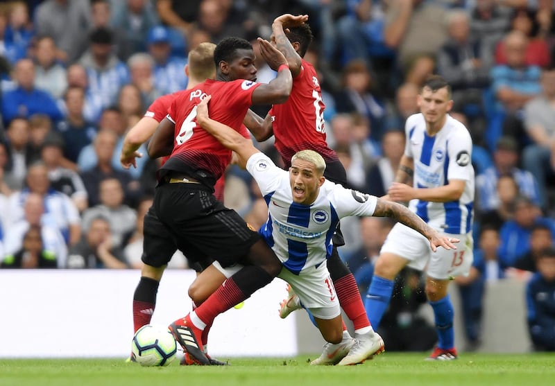 BRIGHTON, ENGLAND - AUGUST 19:  Anthony Knockaert of Brighton and Hove Albion collides with Paul Pogba of Manchester United during the Premier League match between Brighton & Hove Albion and Manchester United at American Express Community Stadium on August 19, 2018 in Brighton, United Kingdom.  (Photo by Mike Hewitt/Getty Images)