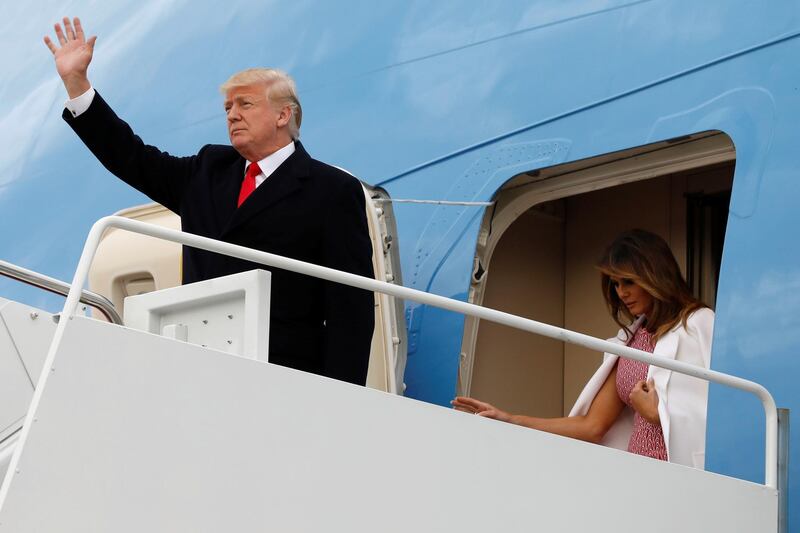 U.S. President Donald Trump and first lady Melania Trump disembark Air Force One at Joint Base Andrews in Maryland, U.S., after the Easter weekend in Palm Beach, Florida, April 1, 2018. REUTERS/Yuri Gripas