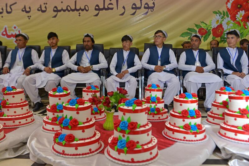 Grooms wait for the start of a mass marriage ceremony in Kabul. AFP