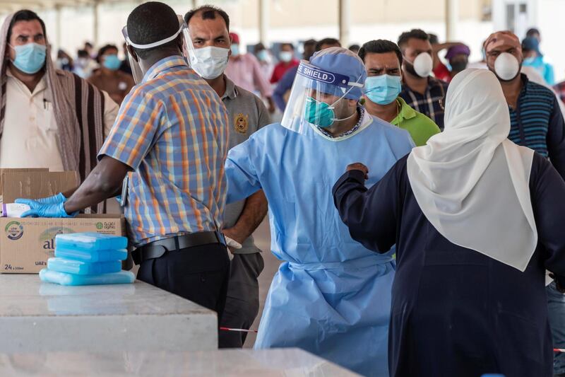 ABU DHABI, UNITED ARAB EMIRATES. 16 APRIL 2020. COVID-19 Testing station in Al Mussafah. Medical staff pre-check individuals ahead of the actual COVID-19 test. (Photo: Antonie Robertson/The National) Journalist: Haneen Dajani. Section: National.