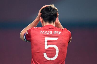 Manchester United's English defender Harry Maguire reacts during the English League Cup semi final first leg football match between Manchester United and Manchester City at Old Trafford in Manchester, north west England, on January 6, 2021. RESTRICTED TO EDITORIAL USE. No use with unauthorized audio, video, data, fixture lists, club/league logos or 'live' services. Online in-match use limited to 120 images. An additional 40 images may be used in extra time. No video emulation. Social media in-match use limited to 120 images. An additional 40 images may be used in extra time. No use in betting publications, games or single club/league/player publications.
 / AFP / POOL / PETER POWELL / RESTRICTED TO EDITORIAL USE. No use with unauthorized audio, video, data, fixture lists, club/league logos or 'live' services. Online in-match use limited to 120 images. An additional 40 images may be used in extra time. No video emulation. Social media in-match use limited to 120 images. An additional 40 images may be used in extra time. No use in betting publications, games or single club/league/player publications.
