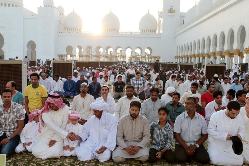 People perform Eid  prayers at Sheikh Zayed Grand Mosque in Abu Dhabi. Christopher Pike / The National