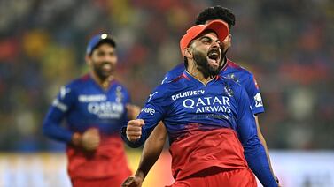Royal Challengers Bengaluru's Virat Kohli (R) celebrates after taking a catch to dismiss Chennai Super Kings' Daryl Mitchell during the Indian Premier League (IPL) Twenty20 cricket match between Royal Challengers Bengaluru and Chennai Super Kings at the M Chinnaswamy Stadium in Bengaluru on May 18, 2024.  (Photo by Idrees MOHAMMED  /  AFP)  /  -- IMAGE RESTRICTED TO EDITORIAL USE - STRICTLY NO COMMERCIAL USE --