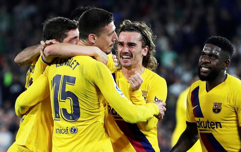 Barcelona's Clement Lenglet celebrates with teammates after scoring against Real Betis. EPA