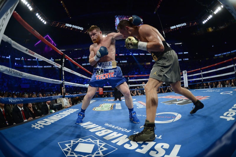 Gennady Golovkin (green trunks) and Saul 'Canelo' Alvarez (blue trunks) during their title fight for Golovkin's IBF, WBA and WBC middleweight championship belts at T-Mobile Arena. The bout ended in a draw. Joe Camporeale / USA Today