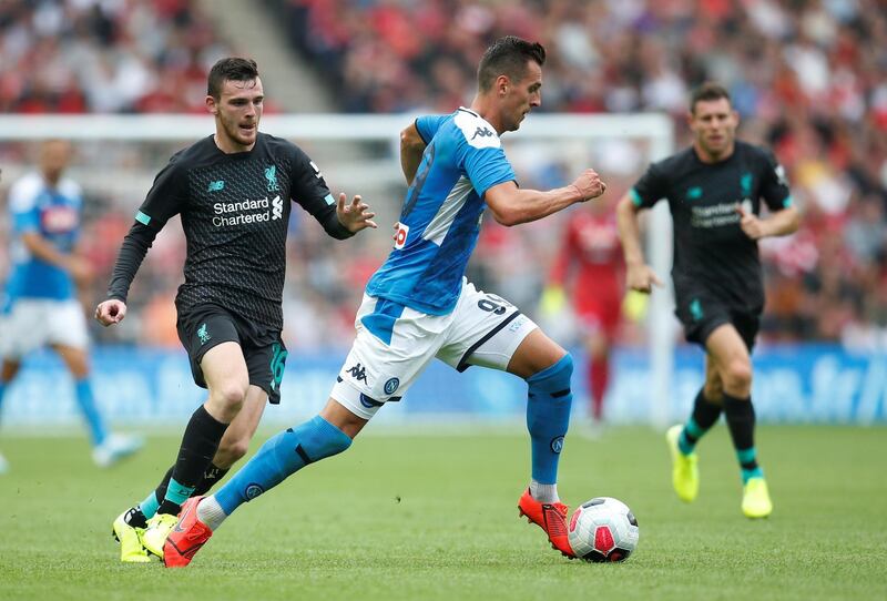 Napoli's Arkadiusz Milik, right, in action. Reuters