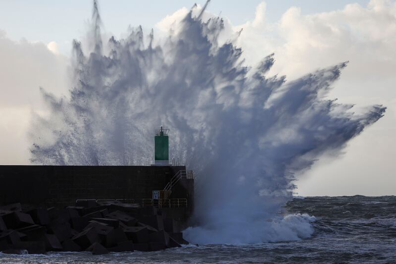Waves hit a lighthouse in Pontevedra, north-western Spain. EPA