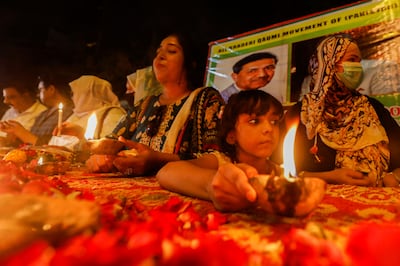 People light oil lamps and candles in memory of Pakistan’s nuclear scientist. Reuters