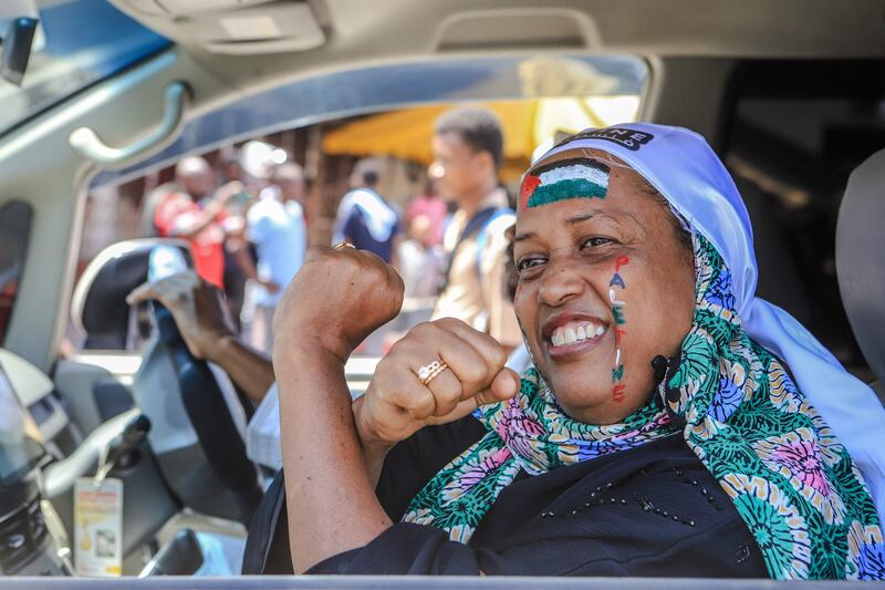 A woman with the Palestinian flag painted on her face during a demonstration in Mombasa, Kenya. AFP