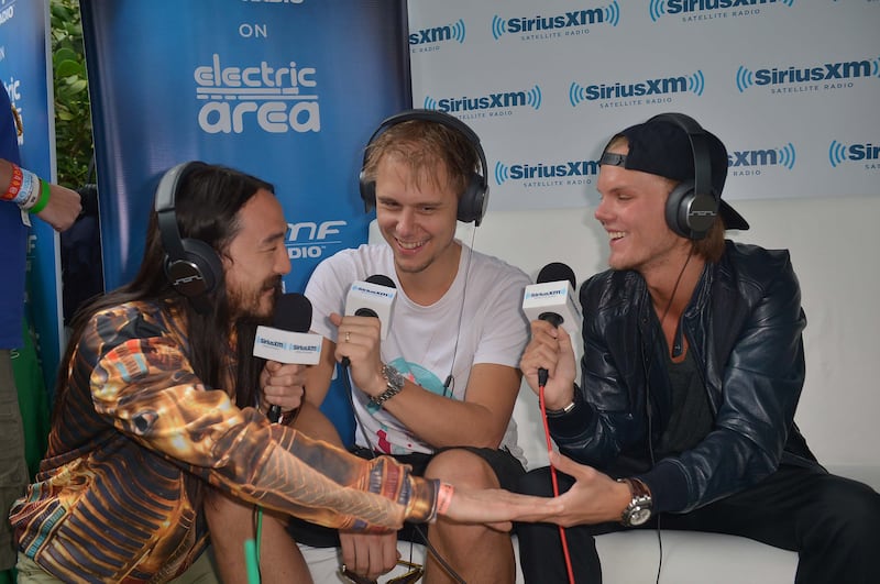 From left, DJs Steve Aoki, Armin van Buuren and Avicii in Miami, Florida in March 2013. Getty Images