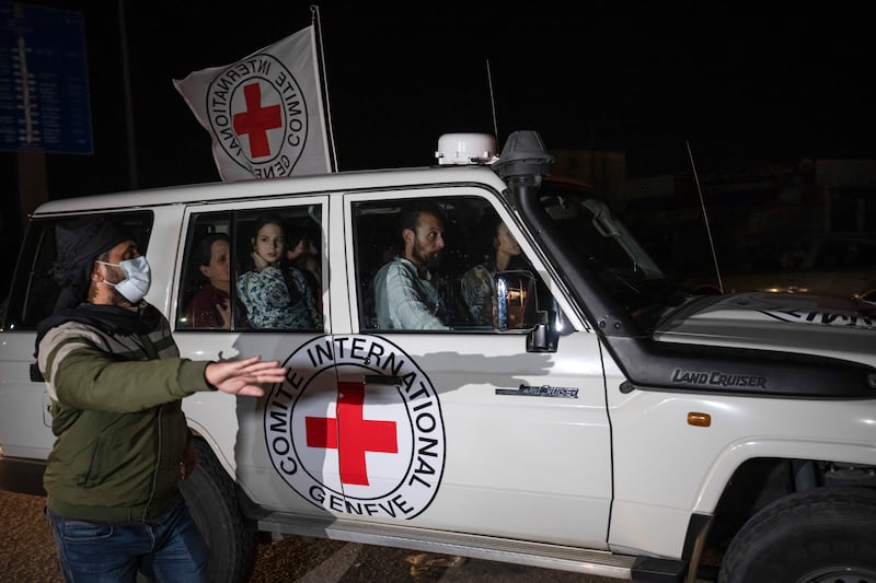 A Red Cross vehicle takes Israeli hostages from the Gaza Strip into Egypt in Rafah on November  25, 2023. AP
