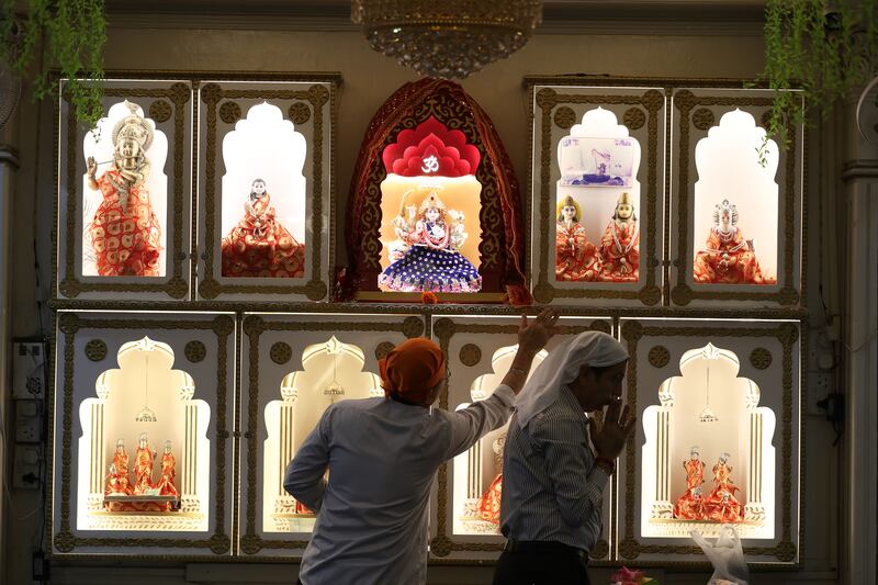 Devotees pray at the Hindu temple in Bur Dubai, one of the oldest UAE temples, before its services move to Jebel Ali. Chris Whiteoak / The National