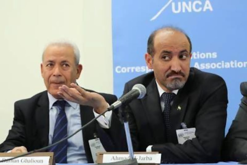 Ahmed Al Jarba, the president of the western-backed Syrian National Coalition, right, and Burhan Ghalioun speaks to reporters after an informal meeting with the Security Council at the United Nations headquarters on Friday. Mary Altaffer / AP Photo