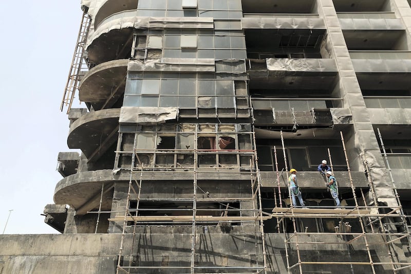 Not sure if I had permission to take these. Was stopped from taking close ups. 

Dubai, United Arab Emirates - August 17, 2019: Update on Zen Tower, Dh25m refurb due to begin following fire there in May 2018. Saturday the 17th of August 2019. Marina, Dubai. Chris Whiteoak / The National