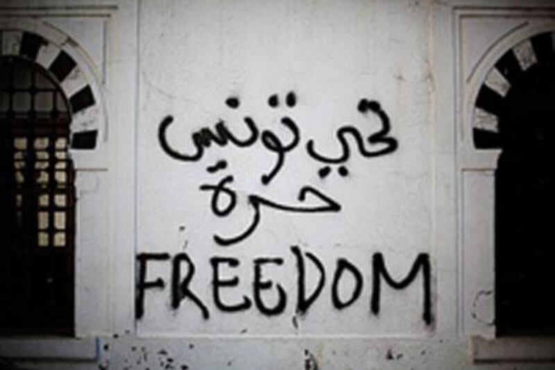 Revolutionary graffiti adorns a wall of the prime minister’s office in Tunis on January 22.