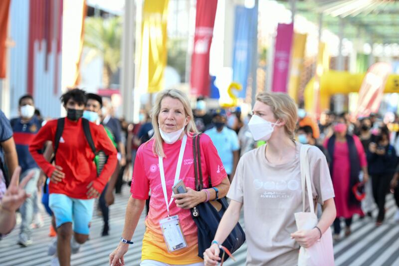 Participants go past pavilions and Al Wasl Plaza during the walk. Khushnum Bhandari / The National