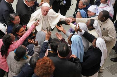 Pope Francis is greeted by a group of nuns during the weekly general audience he held in the Pope Paul VI hall, at the Vatican, Wednesday, Jan. 30, 2019. (AP Photo/Andrew Medichini)