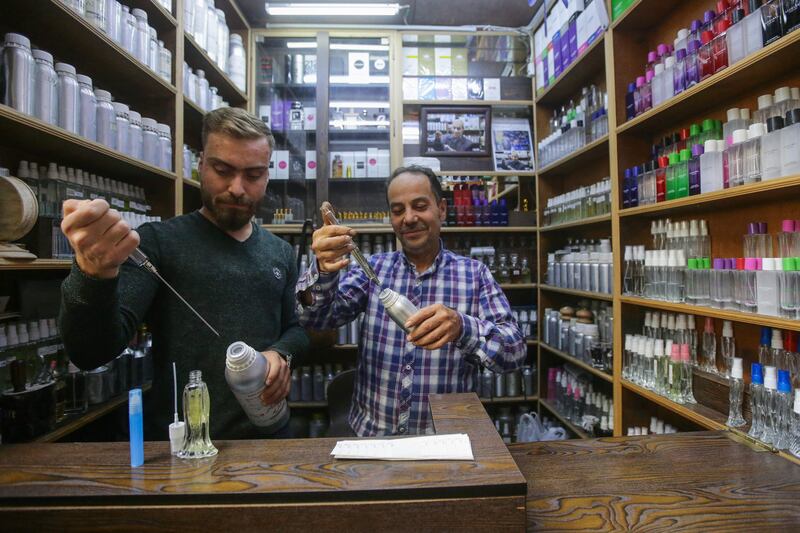 Dozens of customers flock daily to his tiny store, nestled in the historic market of Damascus's old city, many flashing photos on their phones of high-end perfumes they want to replicate.