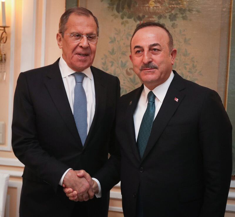 Turkish Foreign Minister Mevlut Cavusoglu meets with his Russian counterpart Sergei Lavrov during the Munich Security Conference in Munich, Germany, February 15, 2020. Turkish Foreign Ministry/Handout via REUTERS ATTENTION EDITORS - THIS PICTURE WAS PROVIDED BY A THIRD PARTY. NO RESALES. NO ARCHIVE