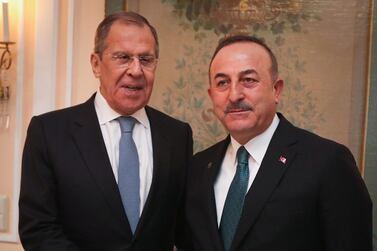 Turkish Foreign Minister Mevlut Cavusoglu with his Russian counterpart Sergey Lavrov at the Munich Security Conference on February 15, 2020. Turkish Foreign Ministry via Reuters