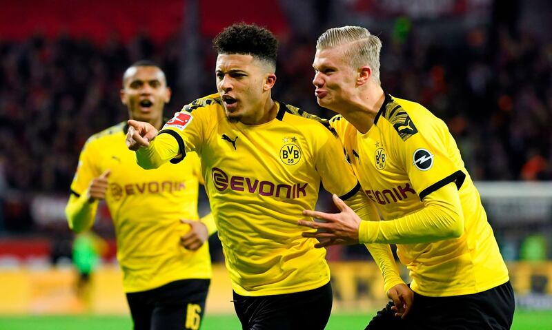 (L-R) Dortmund's Swiss defender Manuel Akanji, Dortmund's English forward Jadon Sancho and Dortmund's Norwegian forward Erling Braut Haaland celebrate a goal that was cancelled by VAR during the German first division Bundesliga football match Bayer 04 Leverkusen vs BVB Borussia Dortmund in Leverkusen, western Germany on February 8, 2020.  - RESTRICTIONS: DFL REGULATIONS PROHIBIT ANY USE OF PHOTOGRAPHS AS IMAGE SEQUENCES AND/OR QUASI-VIDEO 
 / AFP / INA FASSBENDER / RESTRICTIONS: DFL REGULATIONS PROHIBIT ANY USE OF PHOTOGRAPHS AS IMAGE SEQUENCES AND/OR QUASI-VIDEO 
