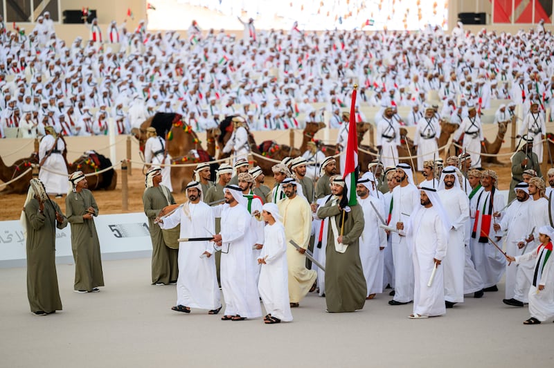 HH Lt Gen Sheikh Saif bin Zayed Al Nahyan, Deputy Prime Minister and Minister of Interior, participates in a traditional ayyala, during the Union Parade, at the Sheikh Zayed Heritage Festival. Seen with Sheikh Khalifa bin Tahnoun, Executive Director of the Martyrs' Families' Affairs Office, Sheikh Diab bin Tahnoon and Sheikh Hamdan bin Mansour. Eissa Al Hammadi for the  Presidential Court  
