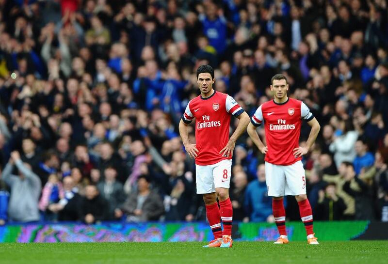 Thomas Vermaelen, right, and Mikel Arteta of Arsenal look on after conceding a third goal during their Premier League loss to Everton at Goodison Park on Sunday in Liverpool, England. Laurence Griffiths / Getty Images / April 6, 2014