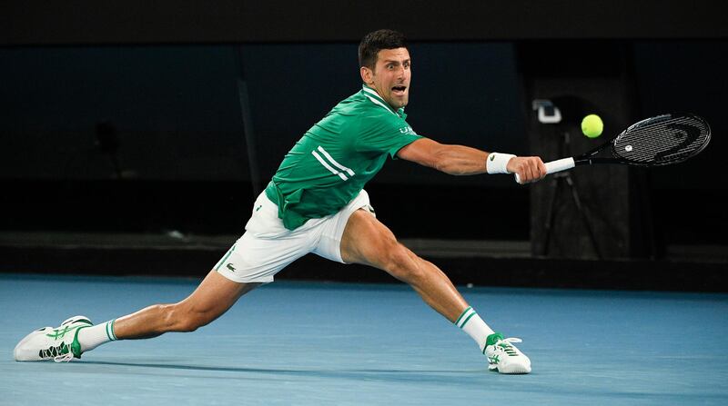 Serbia's Novak Djokovic hits a backhand return to Alexander Zverev of Germany in Melbourne. PA