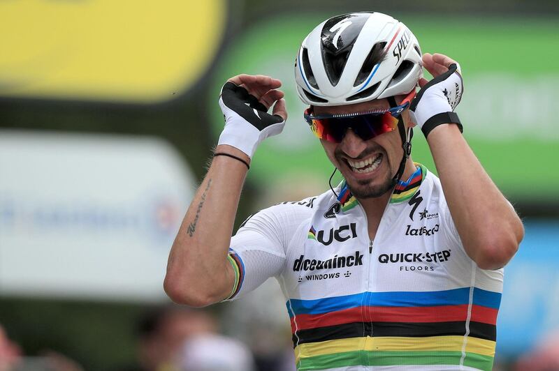 French rider Julian Alaphilippe celebrates winning Stage 1, a 197km ride between Brest and Landerneau. AFP