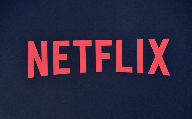 (FILES) In this file photo taken on June 28, 2019 the Netflix logo is seen on the backdrop of Netflix's "Stranger Things 3" premiere at Santa Monica high school Barnum Hall in Santa Monica, California.  Netflix shares dived on July 16, 2020 after the leading streaming entertainment service reported relatively flat quarterly profits despite rising subscriber numbers. / AFP / Chris Delmas
