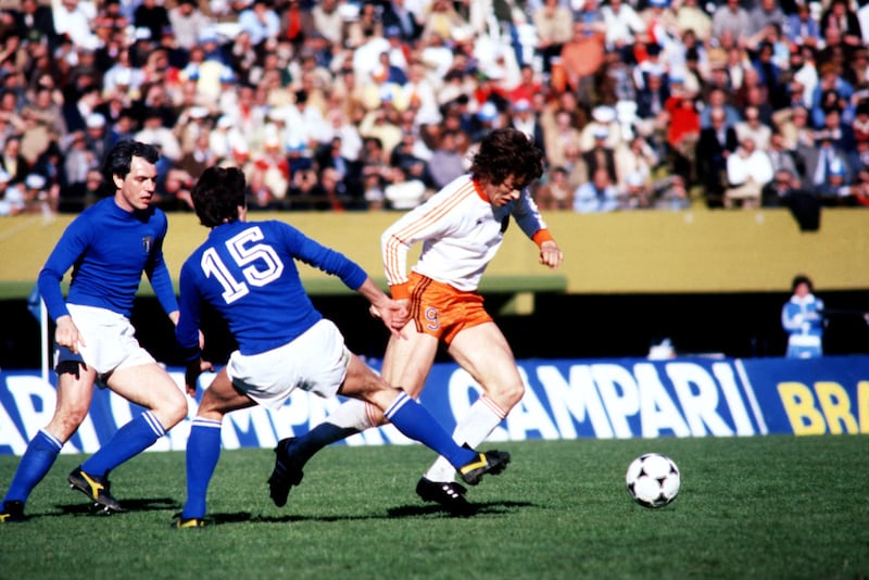 Netherlands' Arie Haan skips past Roberto Bettega and Gaetano Scirea of Italy at the 1978 World Cup in Argentina. Getty