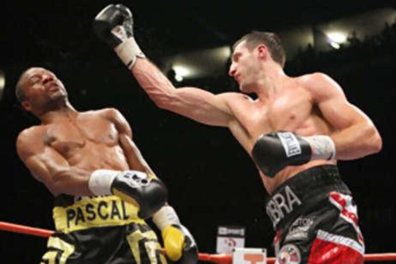 Britain's Carl Froch, right, throws a punch at Canada's Jean Pascal during their WBC super-middleweight title contest in Froch's hometown of Nottingham.