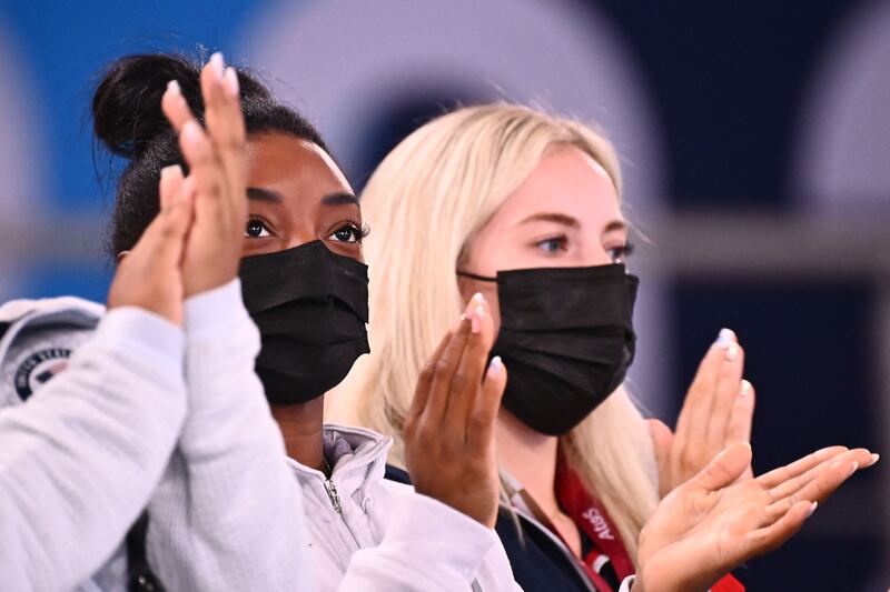 USA's Simone Biles applauds as she attends the artistic gymnastics women's all-around final during the Tokyo 2020 Olympic Games.
