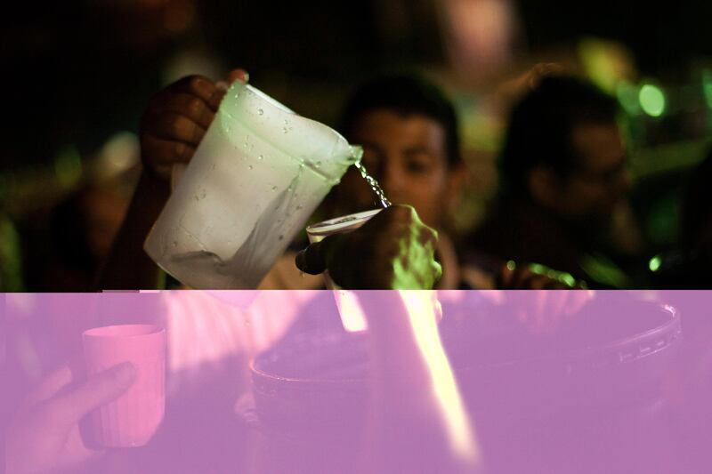 A supporter of the ousted Egypt's President Mohammed Morsi pours water into a cup during Iftar, evening meal when Muslims break their fast during the Islamic month of Ramadan, in Nasr City, a suburb of Cairo, Egypt, Wednesday July 10, 2013. After a week of violence and mass demonstrations, Egyptians were hoping that Wednesday's start of the Muslim holy month of Ramadan will significantly calm the streets. The sunrise-to-sunset fast cuts down on daytime activity, although there are fears of unrest at night. (AP Photo/Manu Brabo) *** Local Caption ***  Mideast Egypt.JPEG-0d4a1.jpg