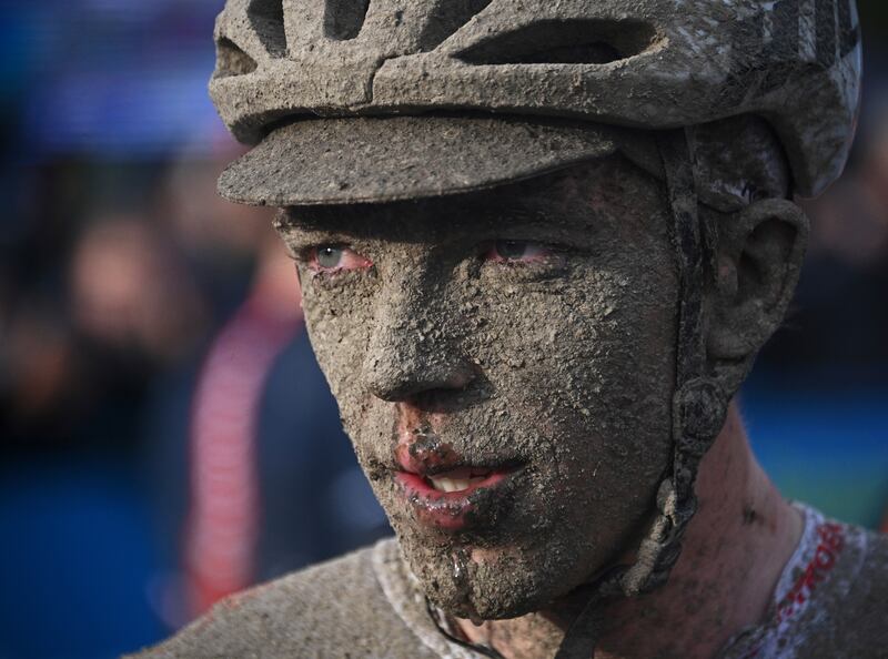 Mud covers the face of Belgian rider Stan Dewulf after the Paris-Roubaix one-day race on Sunday, October  3. AP