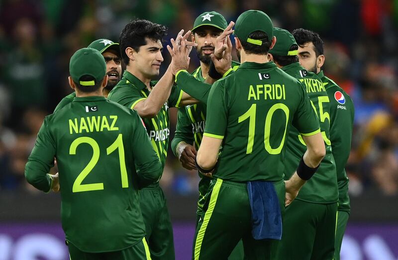 Naseem Shah of Pakistan is congratulated by teammates after getting the wicket of KL Rahul at the Melbourne Cricket Ground. Getty
