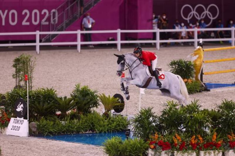 Switzerland's Martin Fuchs rides Clooney 51 in the equestrian's jumping individual qualifying.