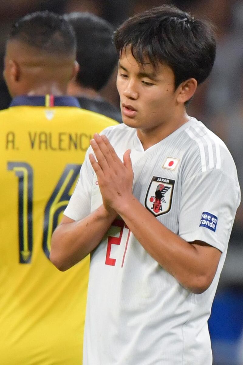Japan's Takefusa Kubo reacts after a VAR-check disallowed his goal against Ecuador. AFP