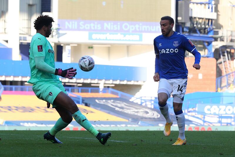 Everton's Cenk Tosun chips home his side's first goal. PA