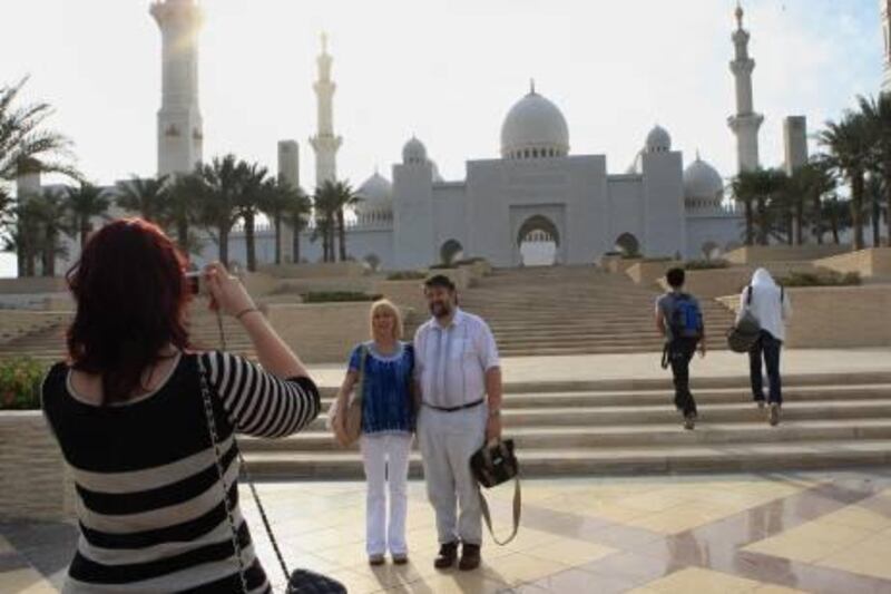ABU DHABI - 02FEB2011 - Tourist taking photograph of Sheikh Zayed bin Sultan grand mosque in Abu Dhabi. Ravindranath K / The National