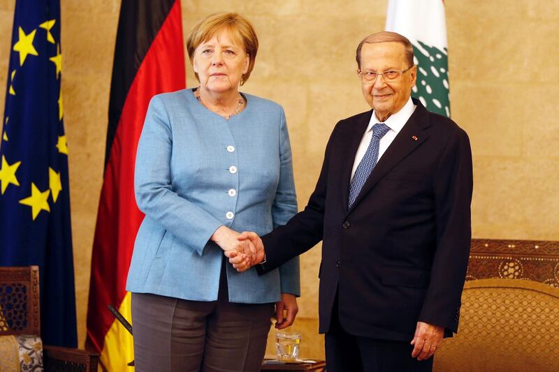 German Chancellor Angela Merkel shakes hands with Lebanon's President Michel Aoun in Baabda, Lebanon June 22, 2018. REUTERS/Mohamed Azakir
