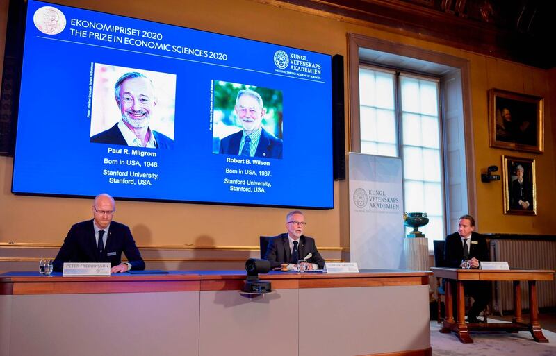 (L to R) Peter Fredriksson, Chairman of the Committee for Economic Sciences, Goran K. Hansson, Permanent Secretary for the Royal Swedish Academy of Sciences and Tommy Andersson, member in The Prize Committee for the Alfred Nobel Memorial Prize in Economic Sciences announce the winners of the "2020 Nobel Prize Sveriges Riksbank Prize in Economic Sciences in Memory of Alfred Nobel" at the Royal Swedish Academy of Sciences in Stockholm on October 12, 2020.  US economists Paul Milgrom and Robert Wilson won the Nobel Economics Prize for work on commercial auctions, including for goods and services difficult to sell in traditional ways such as radio frequencies, the Nobel Committee said. - Sweden OUT
 / AFP / TT News Agency / Anders WIKLUND
