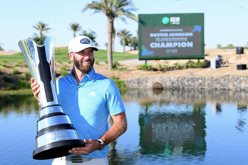 KAEC, SAUDI ARABIA - FEBRUARY 07: Dustin Johnson of the USA poses with the trophy during Day Four of the Saudi International powered by SoftBank Investment Advisers at Royal Greens Golf and Country Club on February 07, 2021 in King Abdullah Economic City, Saudi Arabia. (Photo by Ross Kinnaird/Getty Images)