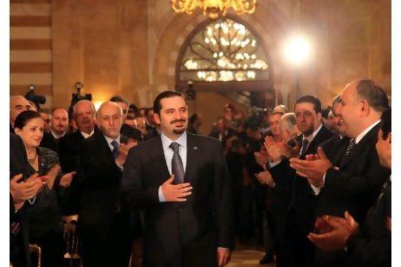 Lebanon's caretaker Prime Minister Saad al Hariri greets his supporters before a news conference in Beirut.