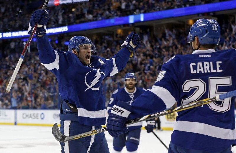 Steven Stamkos, left, scored his first three goals of the season for Tamp Bay on Thursday night. Mike Carlson / Getty Images / AFP